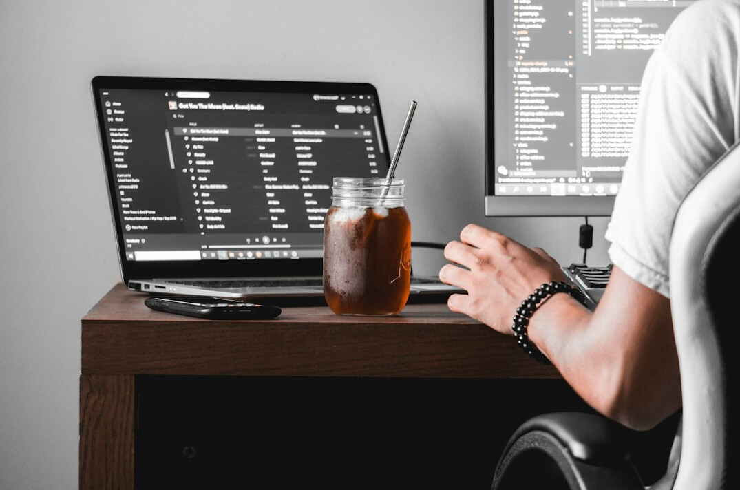 programmer coding at desk
